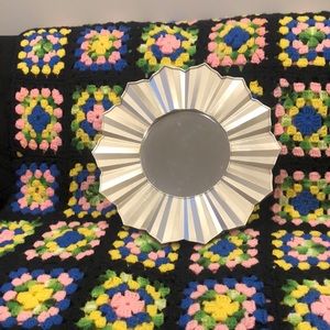 Gold sun shaped mirror